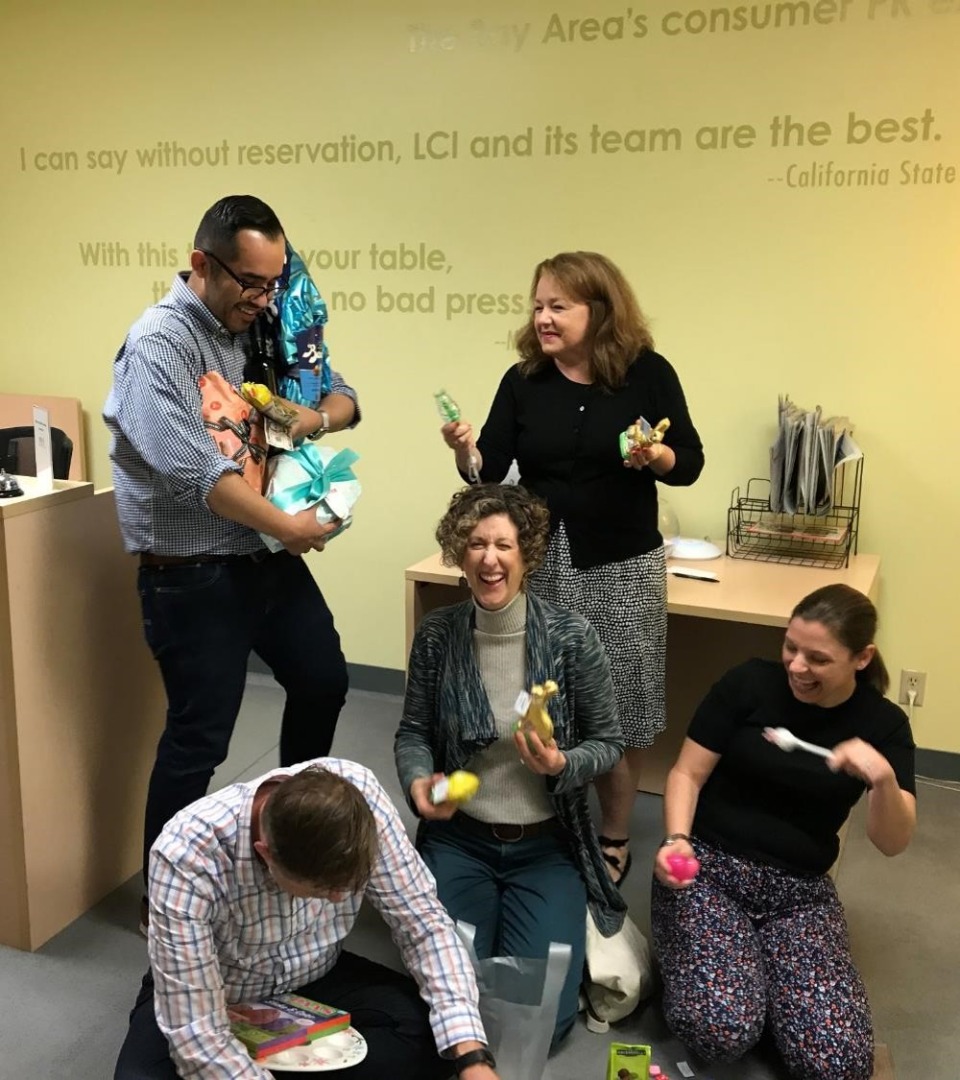 Polly (center) and colleagues during their annual office Easter egg hunt